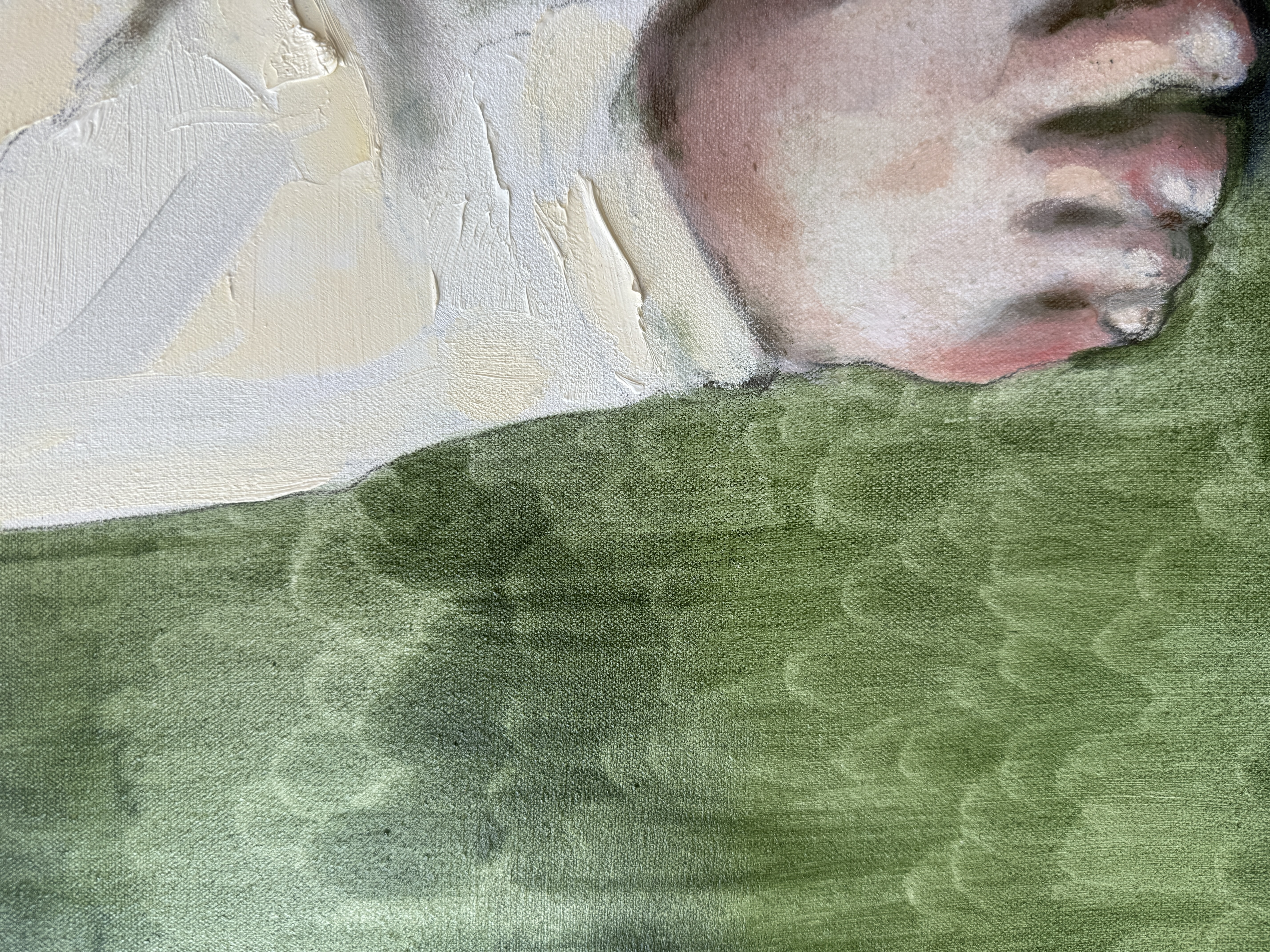 Detail of a bare foot and trouser hem against a textured green ground.