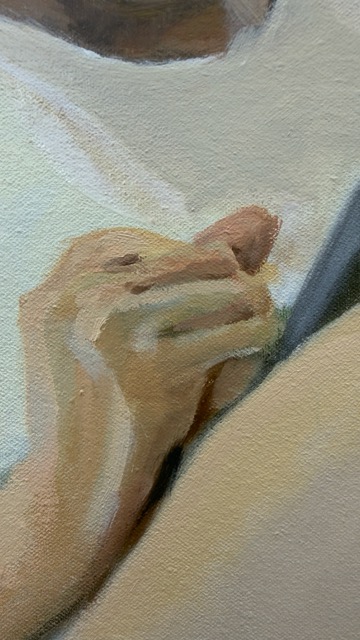 Detail of a hand holding a tablet, painted in soft flesh tones.