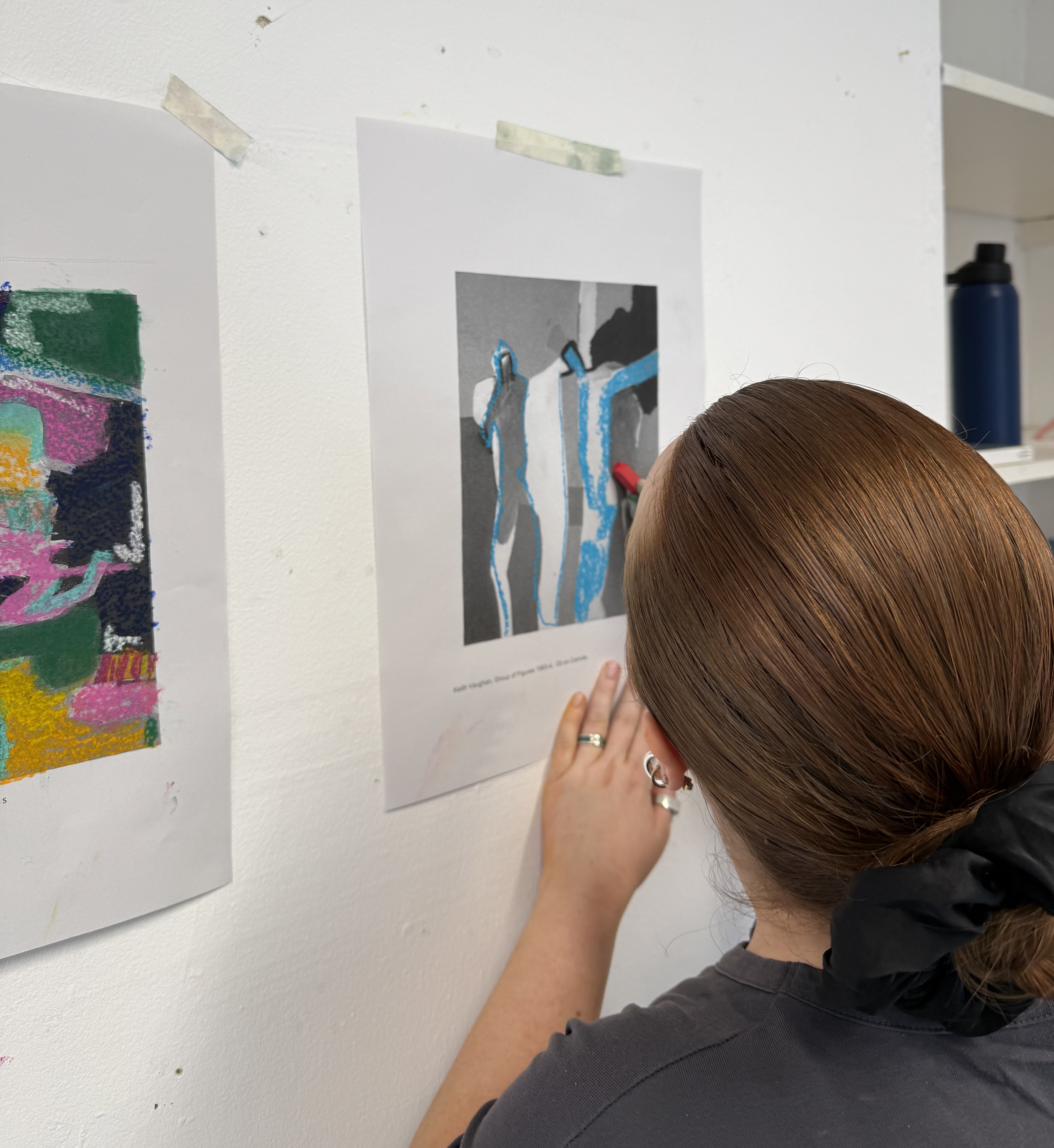 Close-up of a participant working carefully on an image during a Teal Creatives workshop.